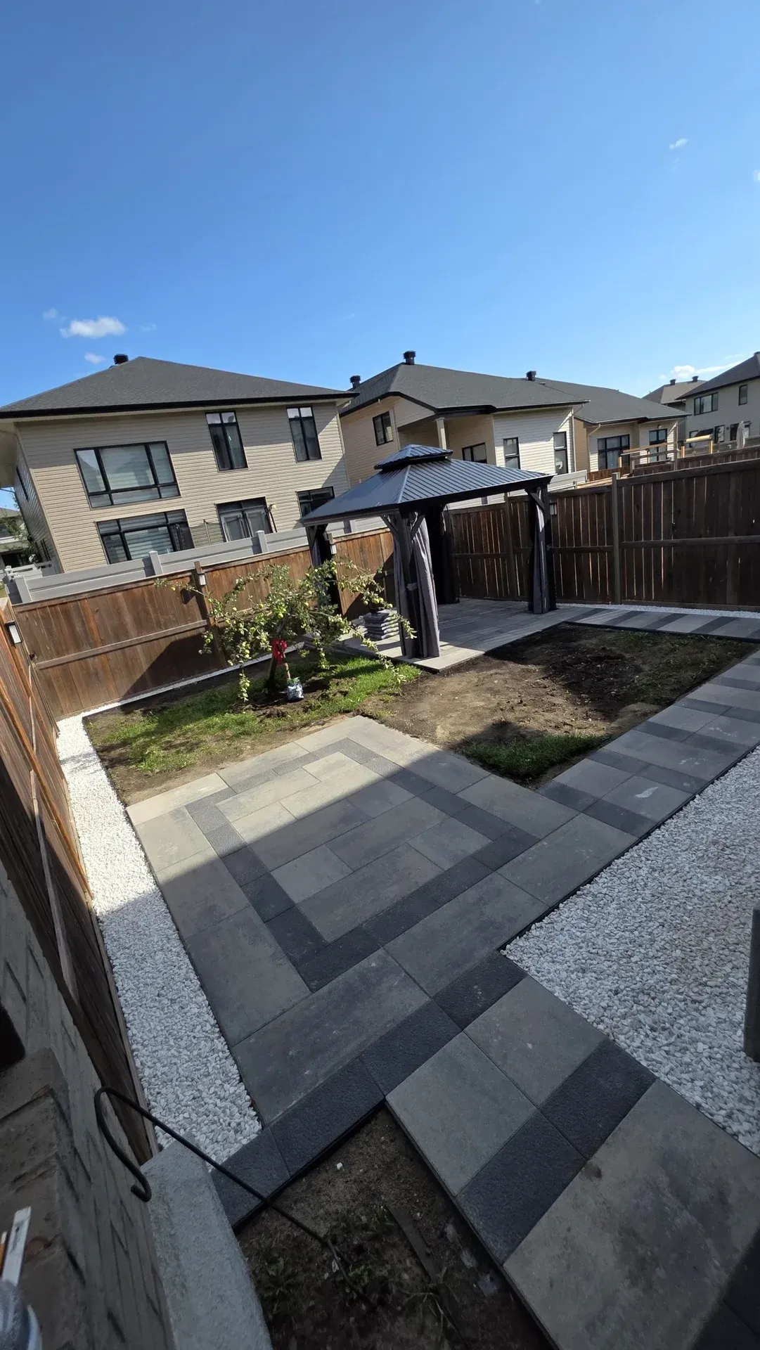 Side Walkway and Backyard Patio in Riverside South — photo 8