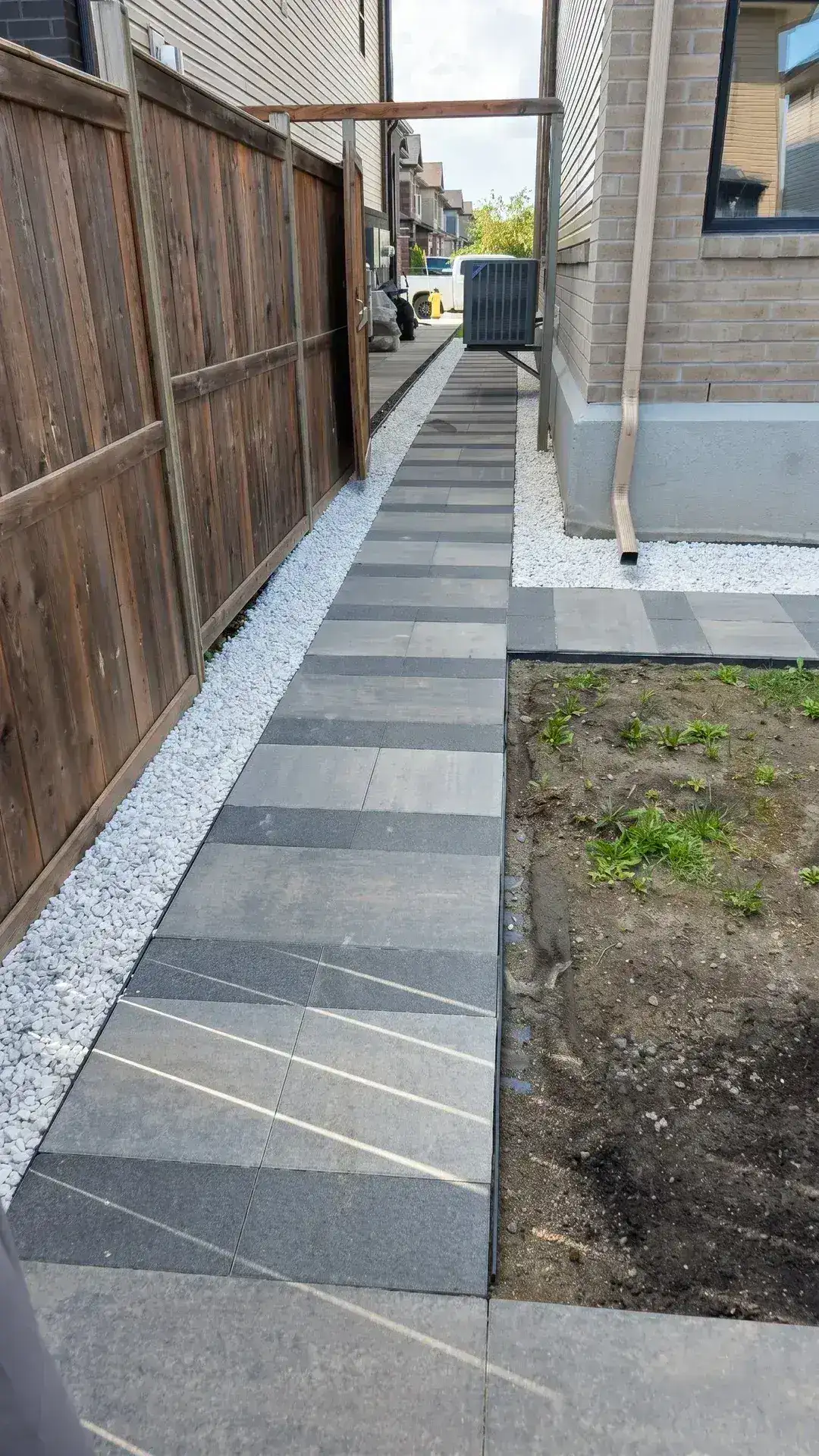 Side Walkway and Backyard Patio in Riverside South — photo 7